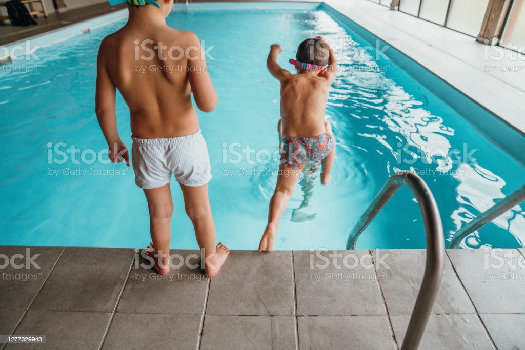 Boys learning to swim for the first time